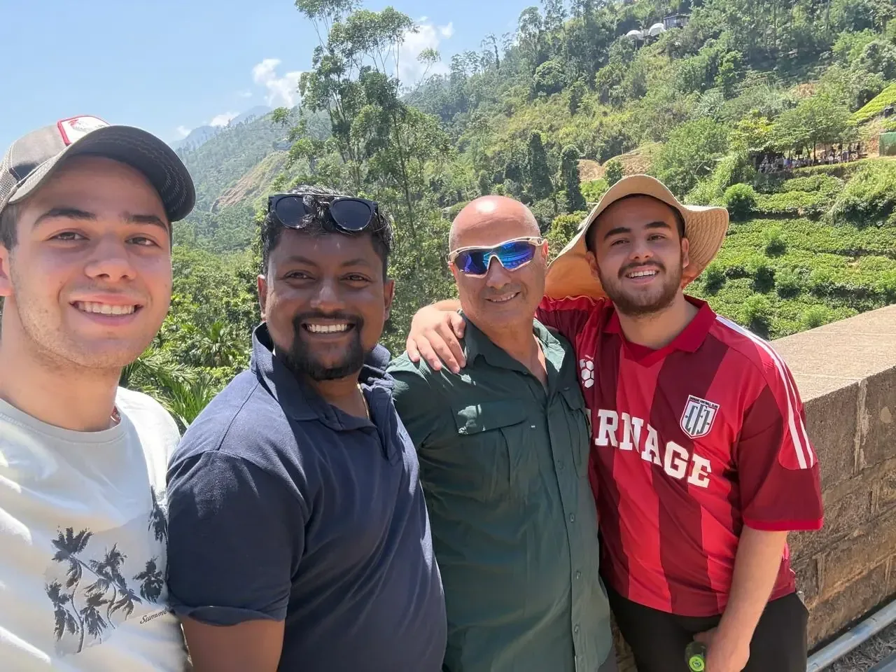 Travelers at a scenic mountain lookout in Sri Lanka
